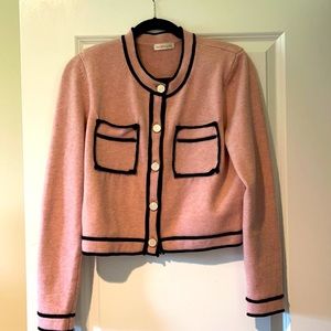Size  medium women’s pink black trimmed sweater jacket.